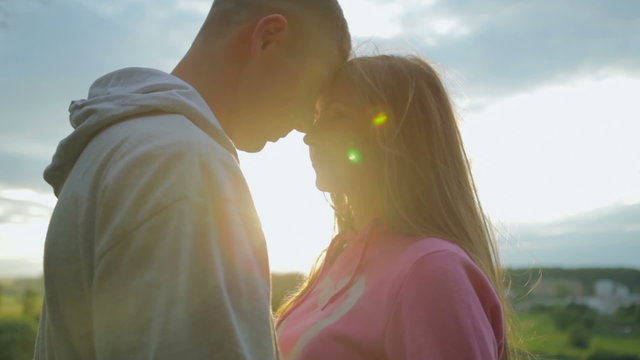 Loving young couple in sunlight