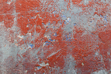 Flaking and peeling, textured paint on hull of old fishing boat.