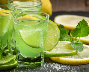 Green cocktail with vermouth, mint and citrus, selective focus