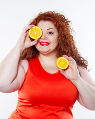 the fat woman with orange juice vegetable fruit holding isolated on the white background