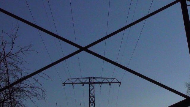 Electricity towers zoom out from detail to pylon row