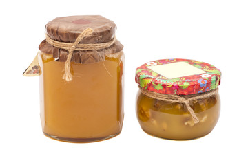 Two honey jars on white background