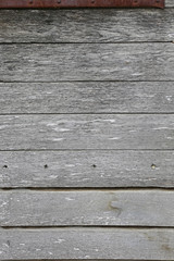 Hintergrund aus alten, grauen Holzbalken