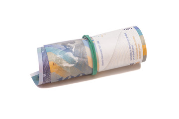 Swiss francs in a roll on white background