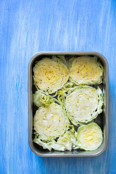 Raw cabbage slices prepared for baking in oven