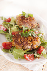 tasty chops with arugula and tomato 