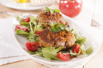tasty chops with arugula and tomato 