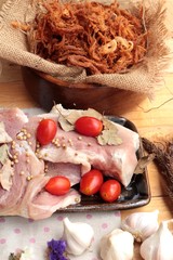 Dry roast pork into strips and raw pork.
