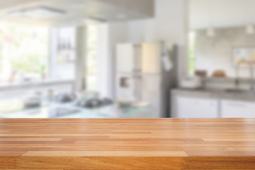 Empty wooden table and blurred kitchen background