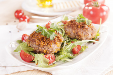 tasty chops with arugula and tomato 