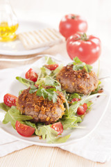 tasty chops with arugula and tomato 