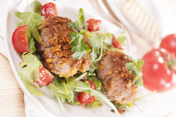 tasty chops with arugula and tomato 