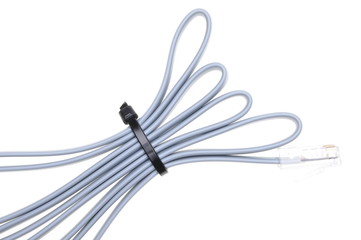 Patch cord with RJ45 plugs and cable ties isolated over white background