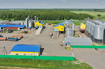 Corn dryer silos standing in machine yard