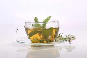 Tea from grasses and mint in a transparent cup