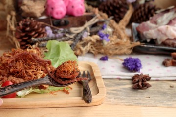 Dry roast pork into strips and raw pork.