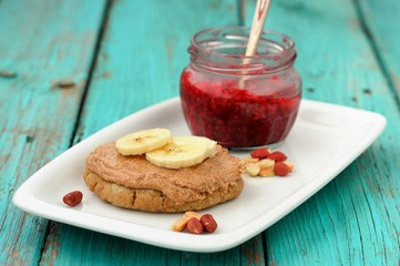 Breakfast of homemade cookie with peanut butter, banana and rasp
