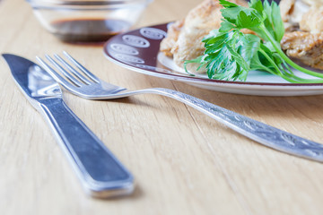 piece of fried chicken with a sprig of parsley