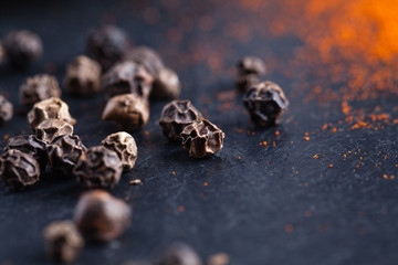 black pepper on plate of slate