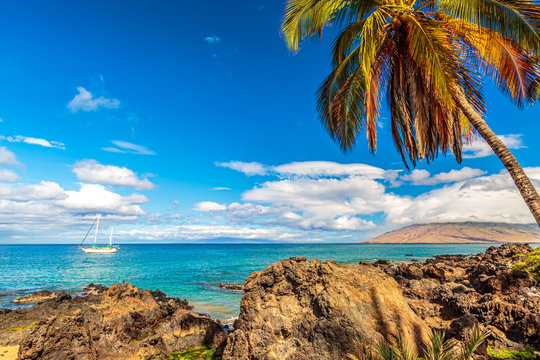 A sailboat moored off the coast of Kamaole Beach in Kihei on Maui, Hawaii