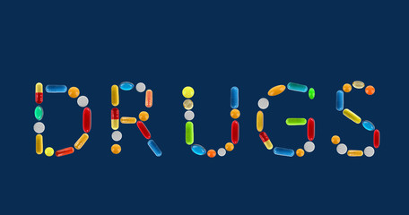 The word Drugs made with pills on dark blue background