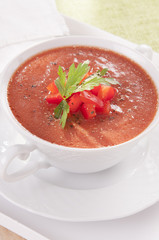tomato soup in a white bowl
