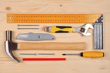 Set of working tools for carpentry works on the wooden table