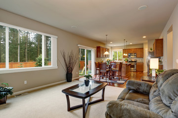 Minimalistic living room with white carpet.