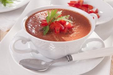 tomato soup in a white bowl
