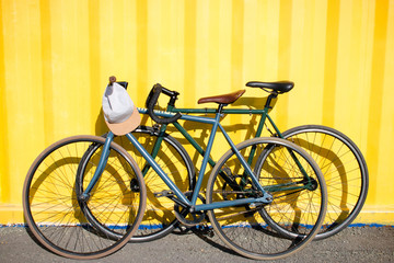 Obraz na płótnie Canvas sport bikes on each other on a yellow background