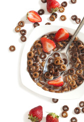 Chocolate cereals and strawberries for breakfast