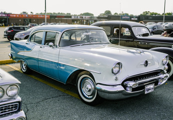 Fototapeta na wymiar Gorgeous amazing front side view of old classic vintage retro car