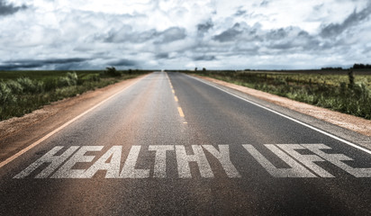 Healthy Life written on rural road