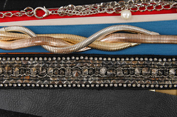 woman many belts texture