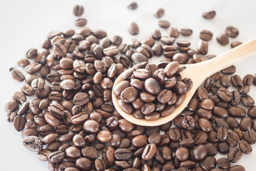 Spoon of roasted coffee bean