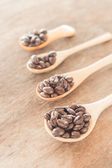 Coffee spoons on grunge wooden table