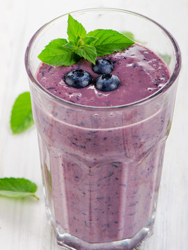 Glass of fresh blueberry smoothie.