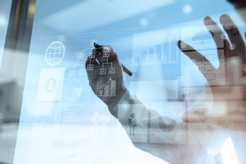 Double exposure of businessman hand working with new modern comp