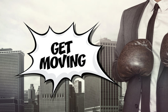 Get Moving Text With Businessman Wearing Boxing Gloves