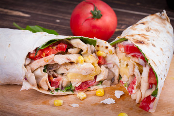 Chicken, Mushroom, Cheese and Spinach Burritos. Glass of Beer