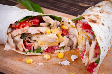Chicken, Mushroom, Cheese and Spinach Burritos. Glass of Beer