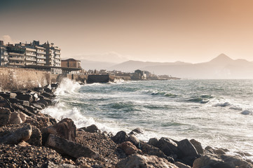 Waves on the seafront at sunset. Heraklion, Crete island, Greece