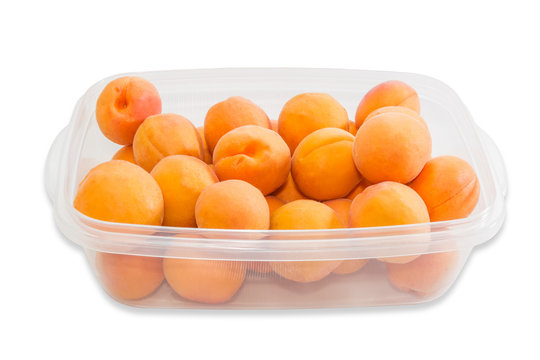 Ripe apricot in plastic tray closeup