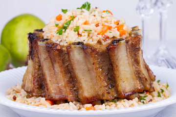 Pork Ribs With Rice, Carrot, Paprika Pepper And Parsley