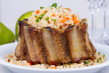 Pork Ribs With Rice, Carrot, Paprika Pepper And Parsley