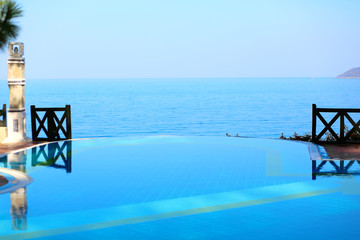 Infinity swimming pool with beautiful view on Aegean Sea at the luxury hotel, Turkey