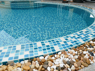 stone on the edge of the swimming pool