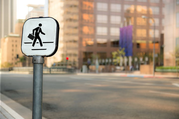 Crosswalk businessman sign bokeh blurred blurry background urban city business district buildings downtown