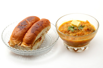 pav bhaji an indian cuisine or dish prepared with crushing mixed vegetables mainly potatoes,tomato,peas and some other green vegetables made spicy and served with butter