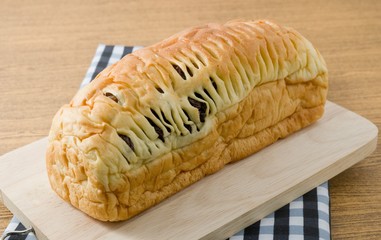 Delicious Raisin Bread on Wooden Cutting Board
